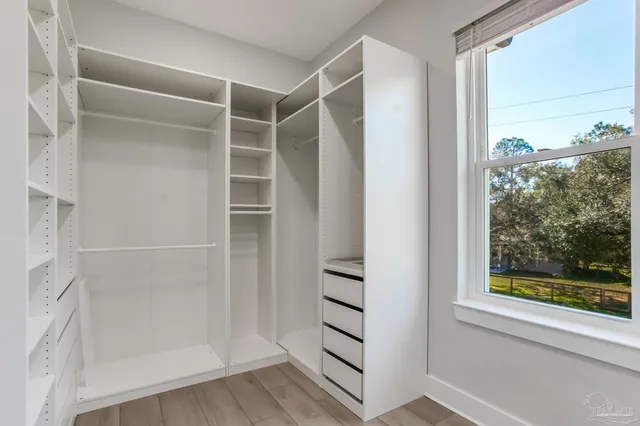 a living room with furniture and a ceiling fan
