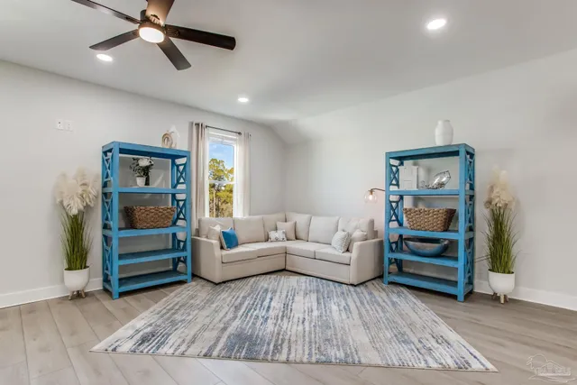 a room with toys and dresser with wooden floor