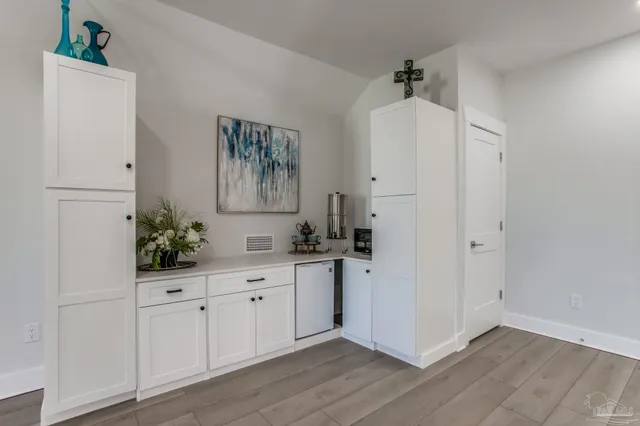 a view of a swimming pool with a yard and palm trees