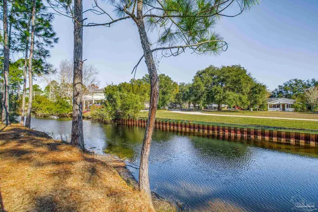 a view of a swimming pool with an outdoor seating