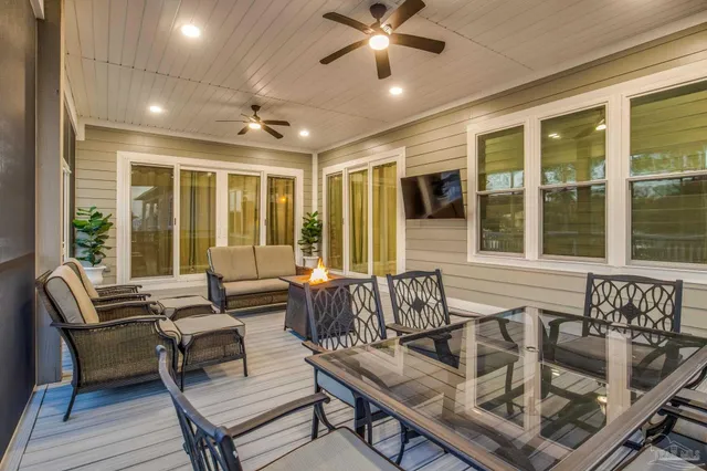 a view of a kitchen with furniture and wooden floor