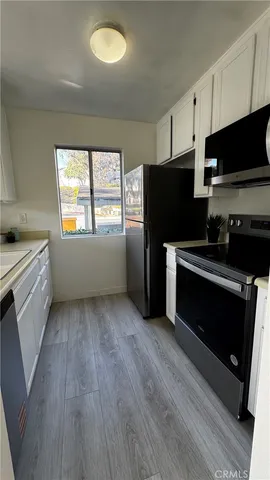 a kitchen with a sink and a window