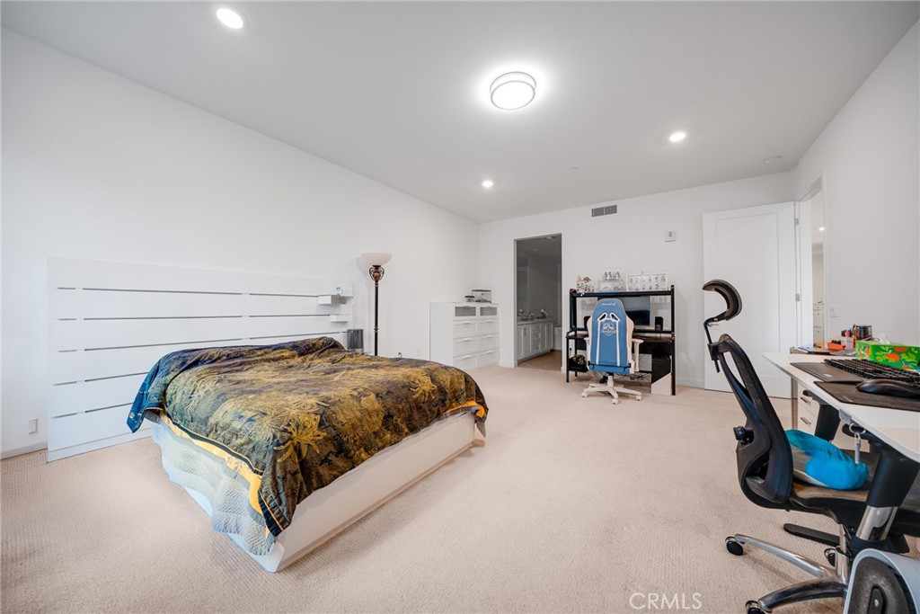 2202 Rivington Irvine, CA 92612 - Photo 11 of 21 a bed room with a bed and gym equipment