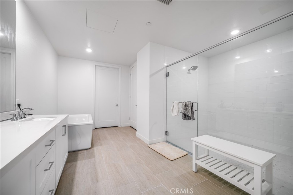 2202 Rivington Irvine, CA 92612 - Photo 12 of 21 a bathroom with a double vanity sink toilet and shower