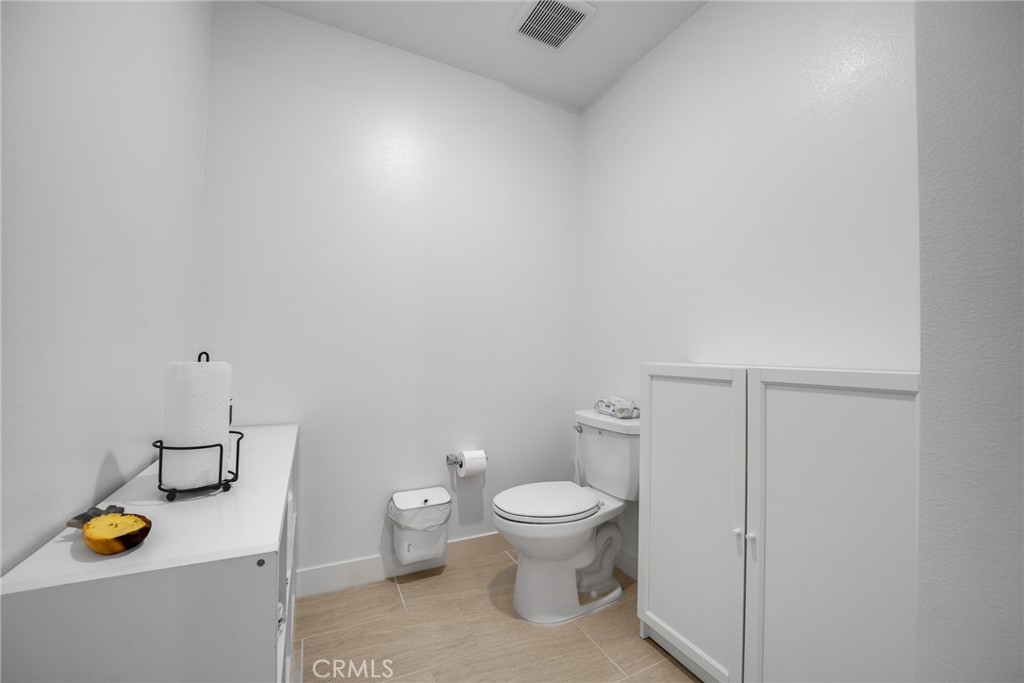 2202 Rivington Irvine, CA 92612 - Photo 13 of 21 a bathroom with a toilet and a shower curtain