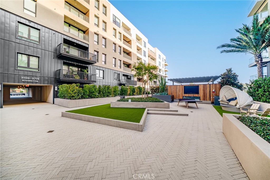 2202 Rivington Irvine, CA 92612 - Photo 20 of 21 a view of a building with a garden and car parked