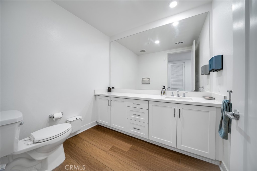 2202 Rivington Irvine, CA 92612 - Photo 4 of 21 a bathroom with a toilet a sink and mirror