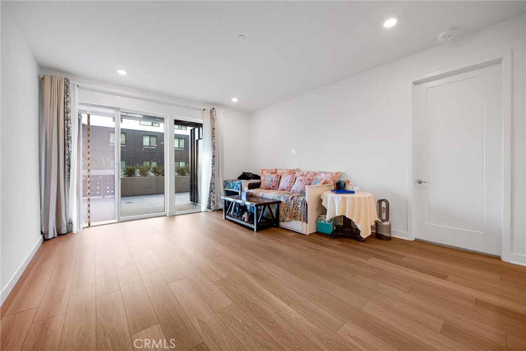 2202 Rivington Irvine, CA 92612 - Photo 7 of 21 a living room with furniture and a gym equipment