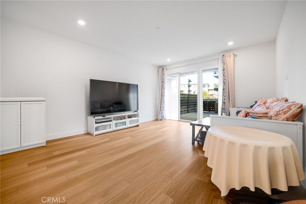 2202 Rivington Irvine, CA 92612 - Photo 8 of 21 a living room with a flat screen tv and a couch