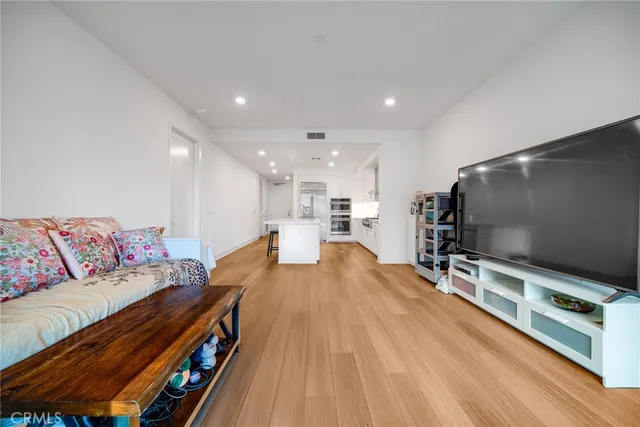a view of a room with furniture and gym equipment