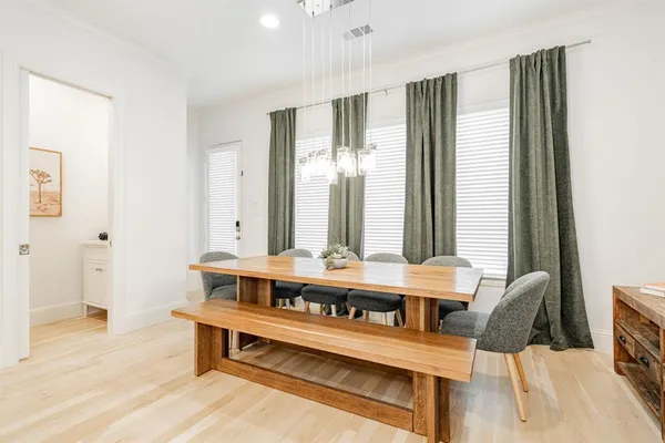 a bedroom with a bed and a mirror