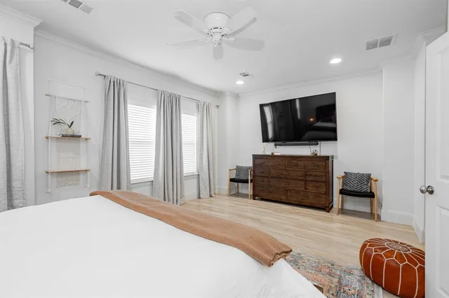 a bedroom with a bed and a couch