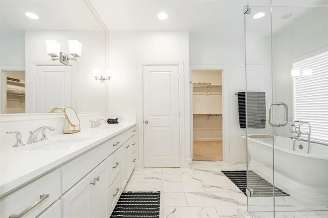 a bathroom with a bathtub sink and toilet