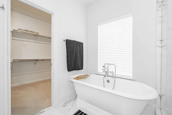 a spacious bathroom with a double vanity sink a mirror and a shower