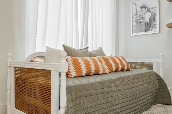 a room with a teddy bear wearing a potted plant