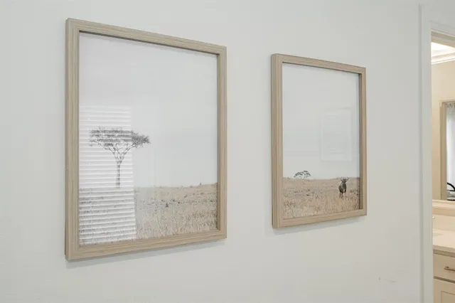 a spacious bedroom with a bed and a window