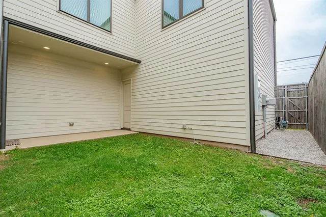 a view of a backyard of the house