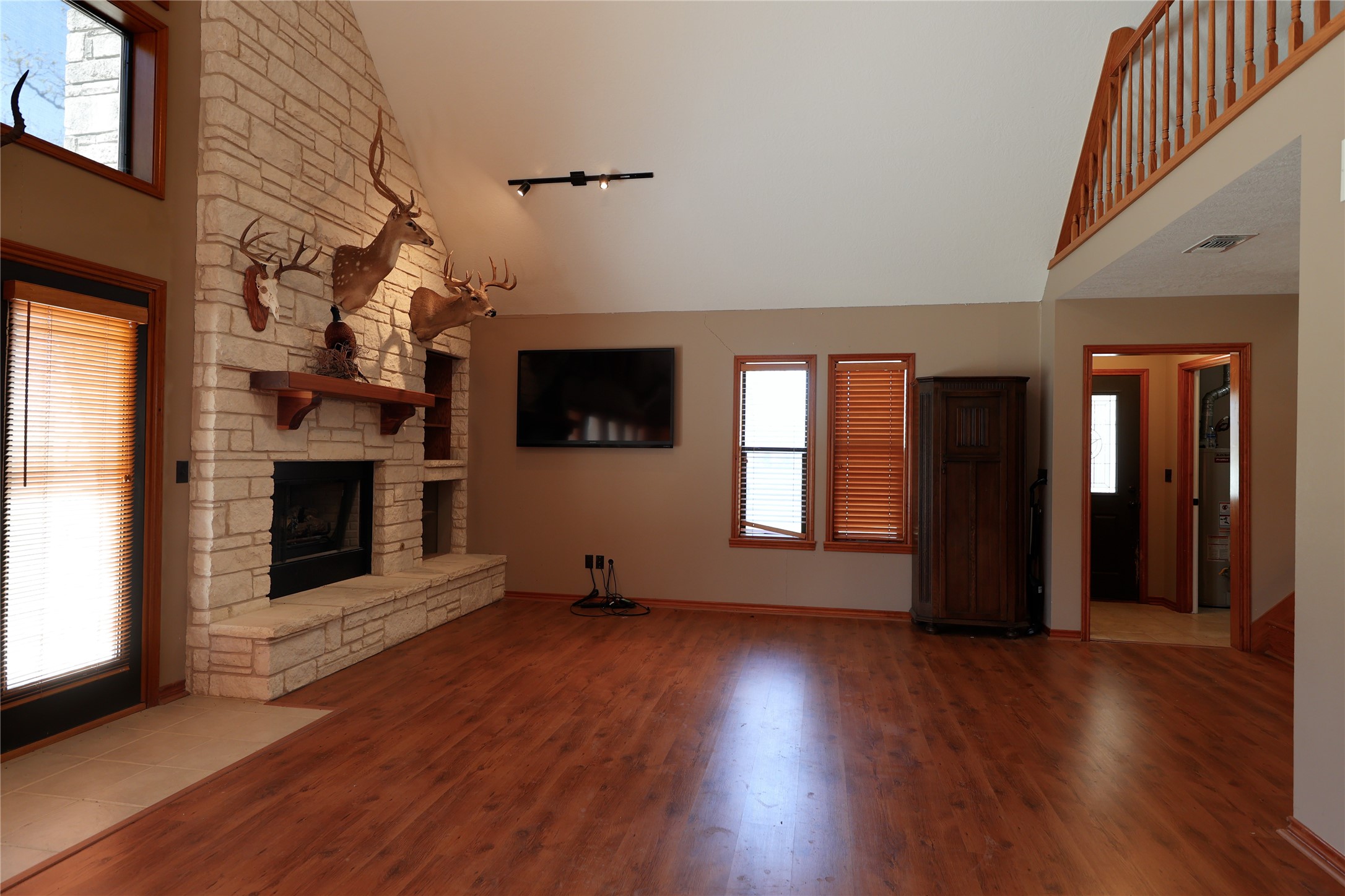 3337 Brunes Mill Road Columbus, TX 78934 - Photo 12 of 48 a view of a livingroom with wooden floor and a fireplace