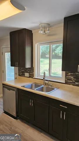 a kitchen with a sink and a window