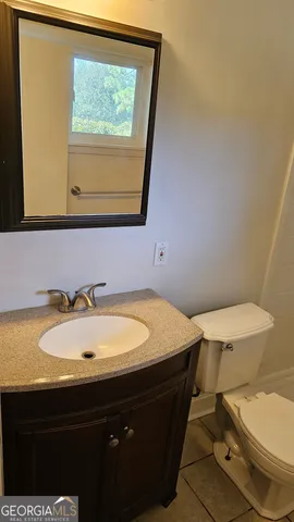 a bathroom with a sink and a toilet