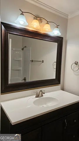 a bathroom with a sink and a mirror