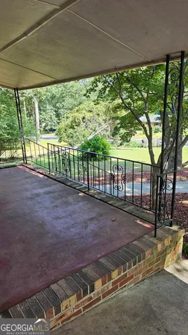 a view of backyard with green space
