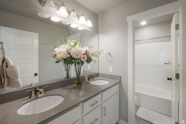 2319 North 3370 West Lehi, UT 84048 - Photo 22 of 30 Bathroom featuring a dual vanity with undermount sinks and gray countertops