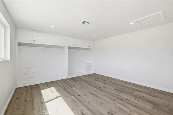 an empty room with wooden floor