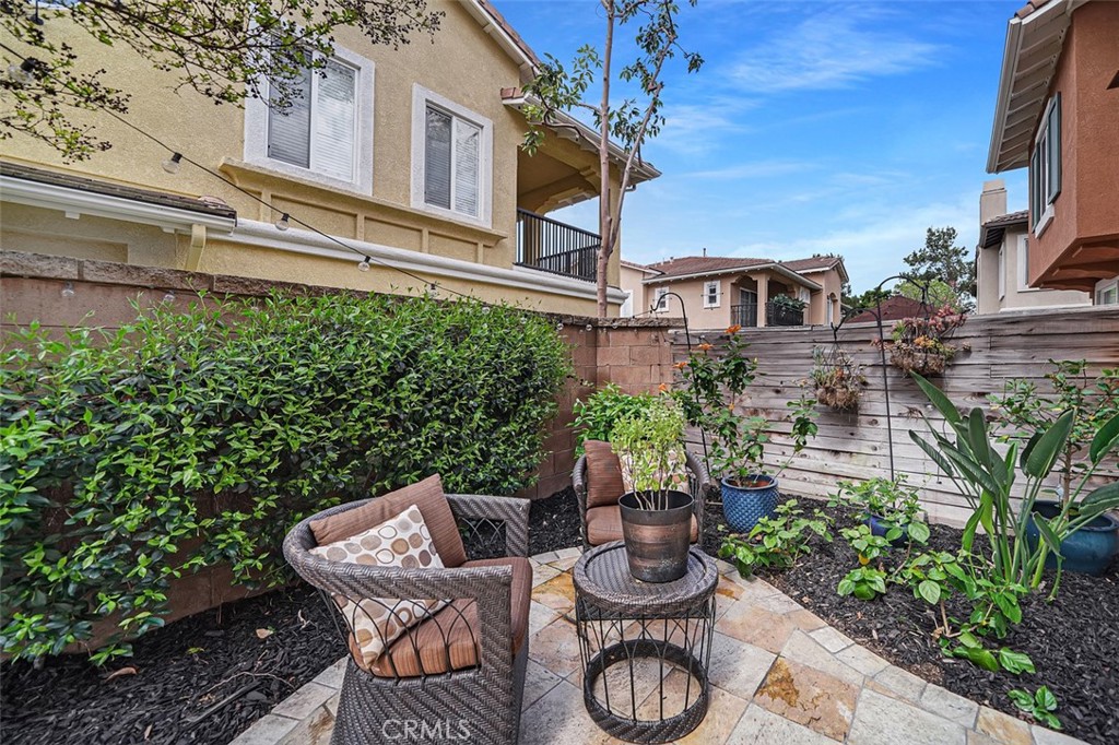 12 Geranium Irvine, CA 92618 - Photo 19 of 20 a view of a patio with table and chairs potted plants and large tree