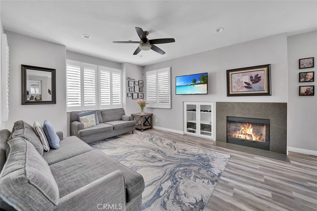12 Geranium Irvine, CA 92618 - Photo 7 of 20 a living room with furniture and a fireplace