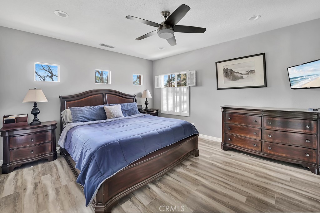 12 Geranium Irvine, CA 92618 - Photo 8 of 20 a bedroom with a bed and wooden floor