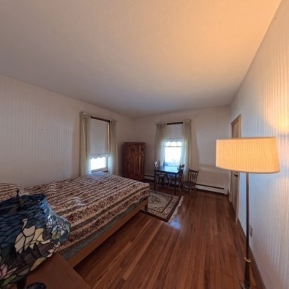 9 Raymond Street, Unit 1 Boston, MA 02134 - Photo 6 of 17 a bedroom with a bed window and a lamp