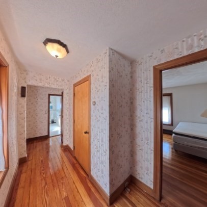 9 Raymond Street, Unit 1 Boston, MA 02134 - Photo 9 of 17 a view of a room with wooden floor and closet