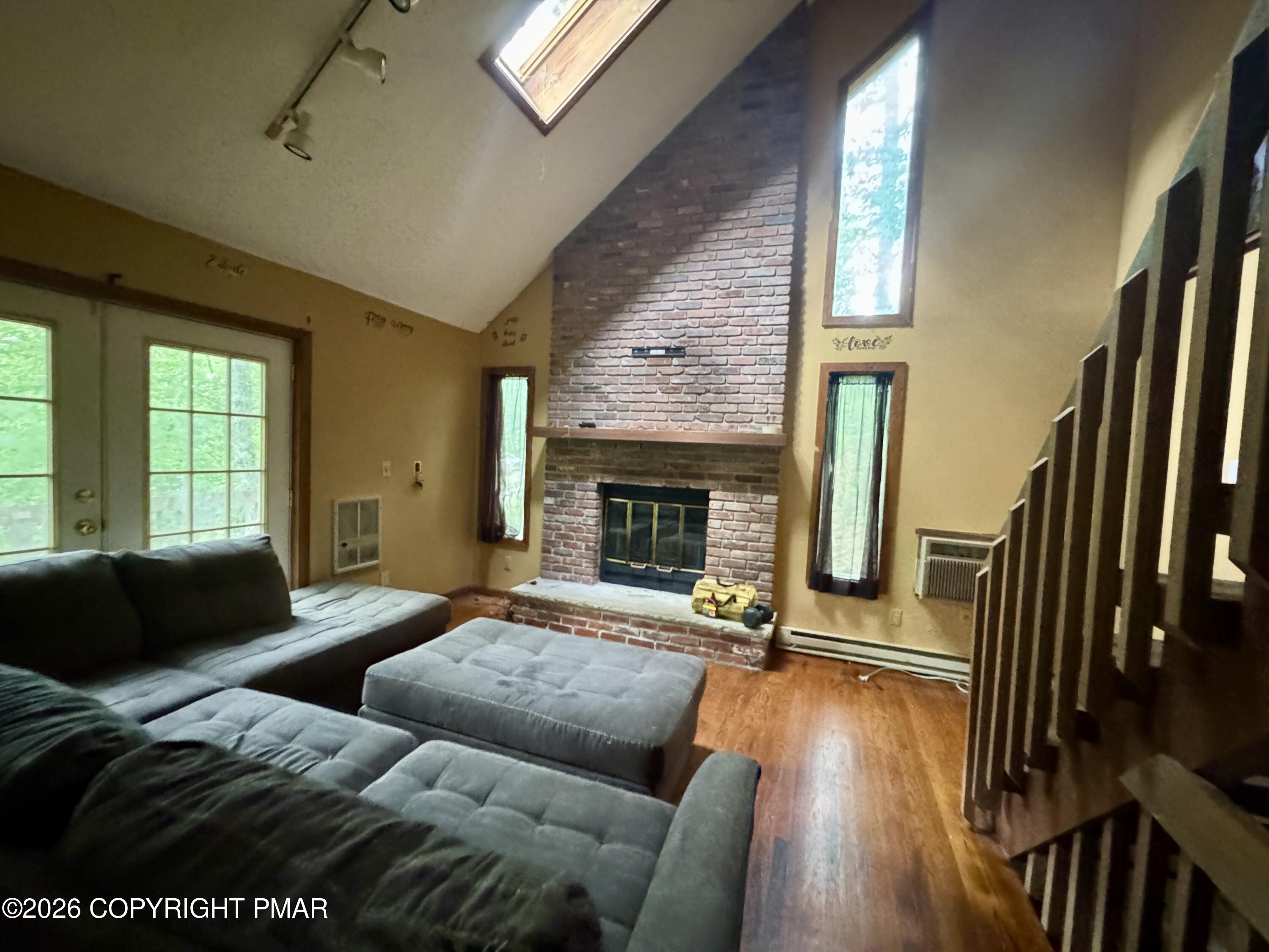 119 Durham Drive Bushkill, PA 18324 - Photo 24 of 41 a living room with furniture and a fireplace