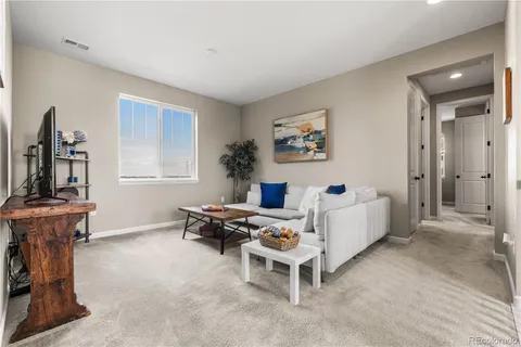 a bed room with furniture and a window