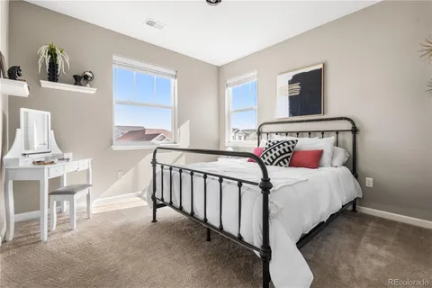 a bedroom with a bed and dresser