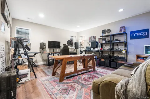 a bed room with a bed and a flat screen tv