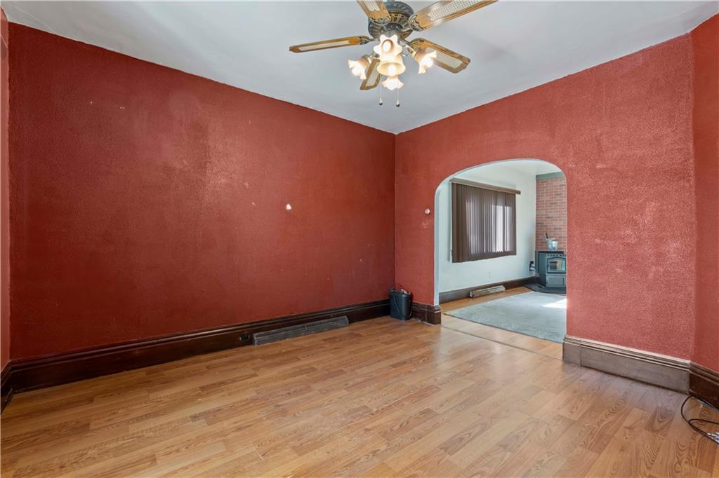 244 5th Street Johnstown, PA 15909 - Photo 12 of 36 an empty room with wooden floor fan and windows