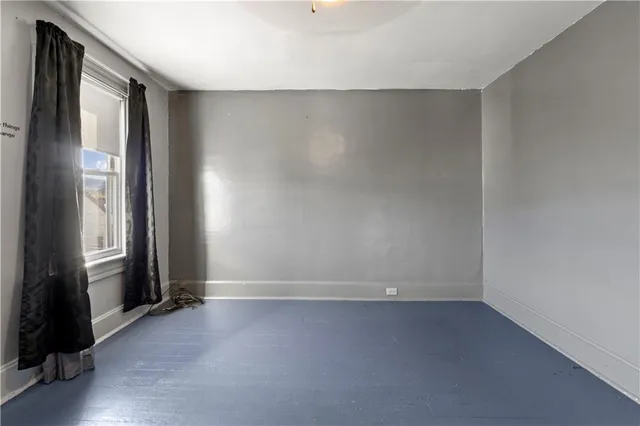 an empty room with closet area