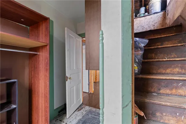 a bathroom with a granite countertop bathtub shower sink vanity and toilet