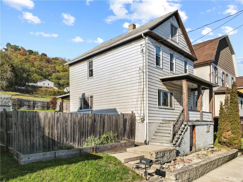 244 5th Street Johnstown, PA 15909 - Photo 2 of 36 a front view of a house with a yard
