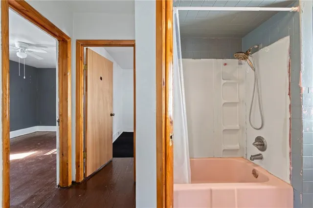 a view of front door with wooden floor