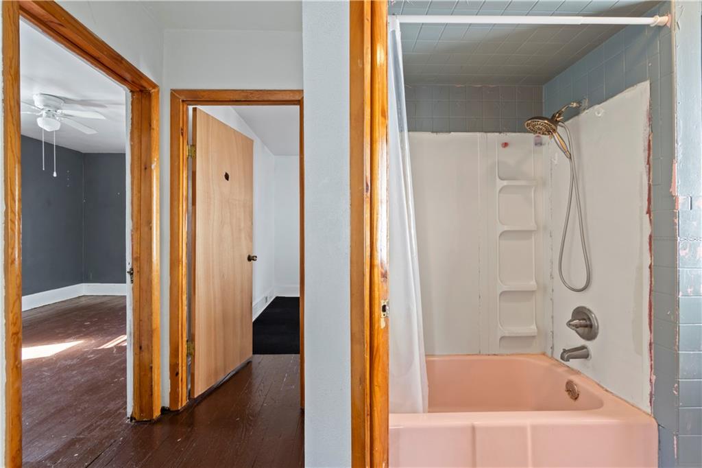 244 5th Street Johnstown, PA 15909 - Photo 23 of 36 a bathroom with a bathtub and a shower