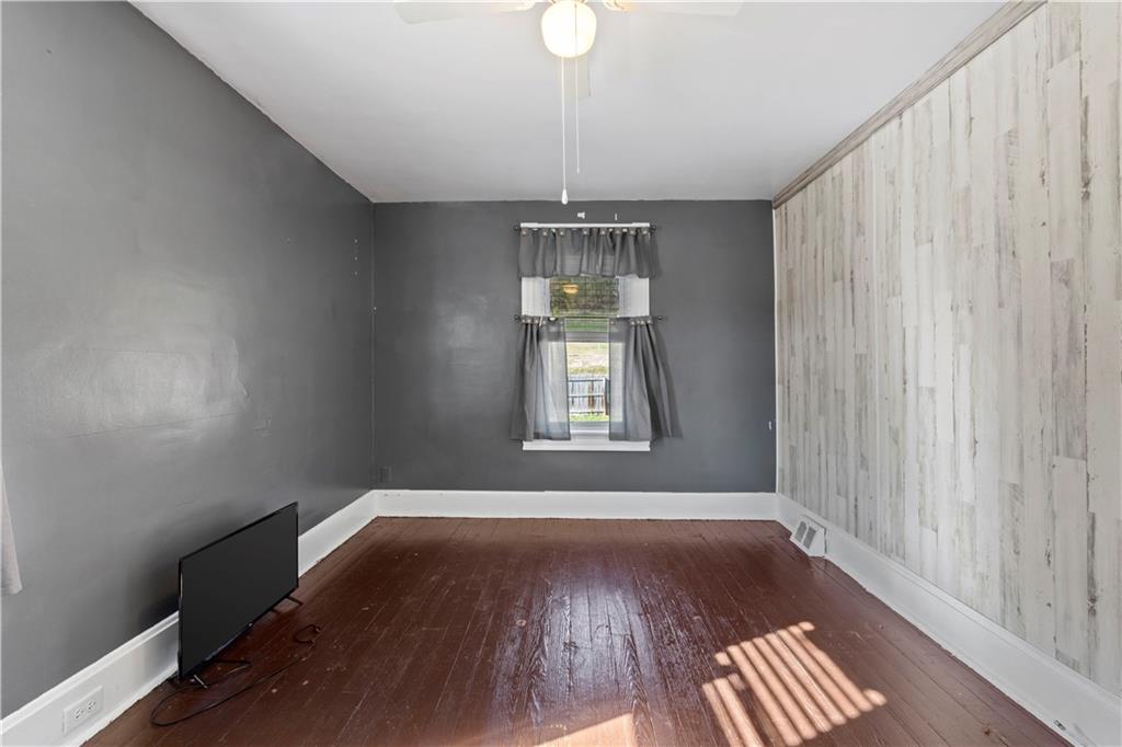 244 5th Street Johnstown, PA 15909 - Photo 24 of 36 a view of empty room with wooden floor and fan