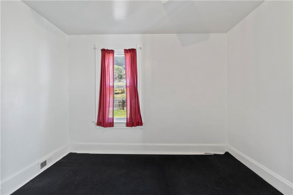 244 5th Street Johnstown, PA 15909 - Photo 28 of 36 a room with a window and a wooden floor