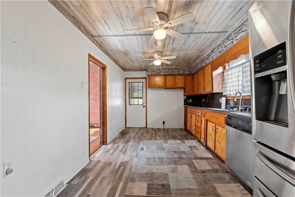 244 5th Street Johnstown, PA 15909 - Photo 4 of 36 a view of a kitchen with a sink and cabinets