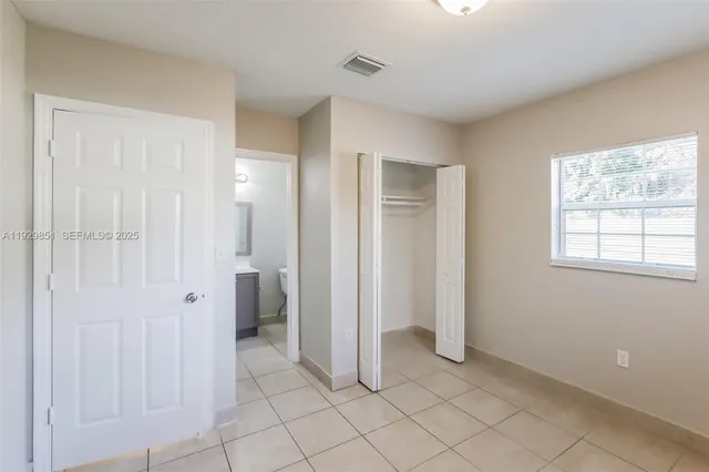 a view of a room with windows and bathroom