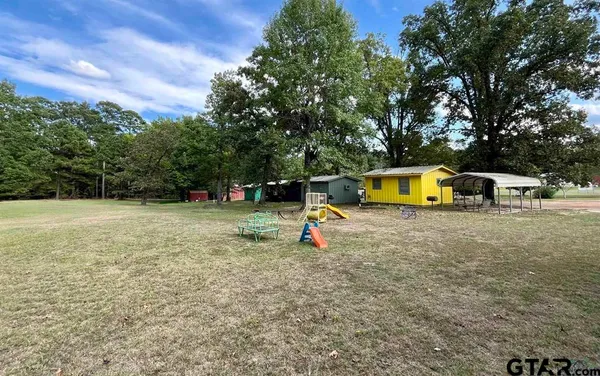 a small swimming pool with a outdoor seating