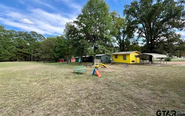 a small swimming pool with a outdoor seating
