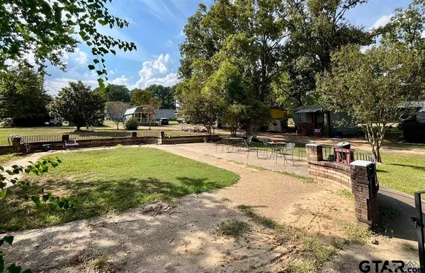a view of backyard with outdoor seating